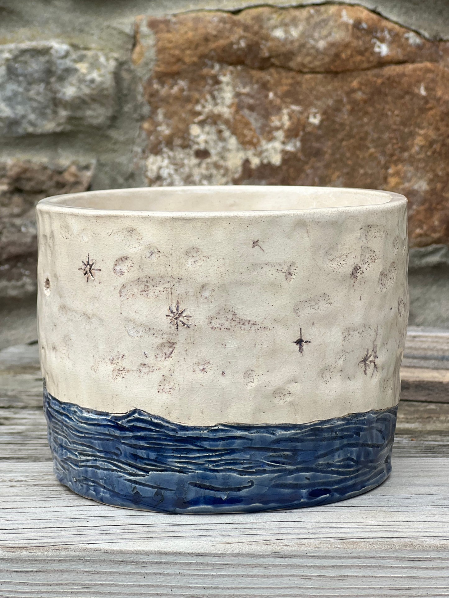 Handcrafted stoneware pot with sea moon and stars design