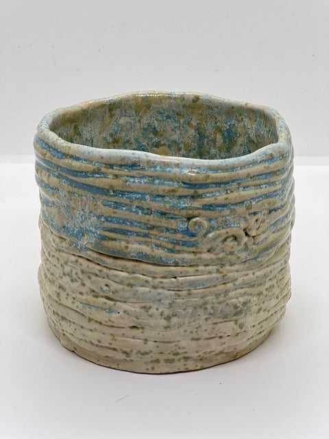Ceramic pot with blue and speckled glaze